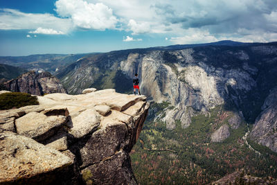 Scenic view of rocks and mountains against sky