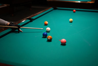 Person playing with ball on table