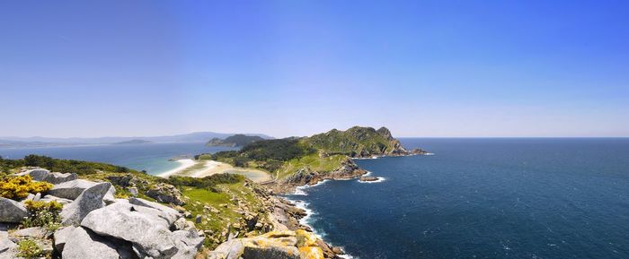 Scenic view of sea against clear blue sky