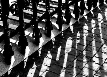 Low section of people walking on street