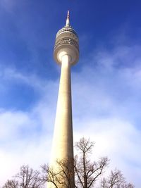 Low angle view of tower against cloudy sky