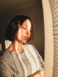 Portrait of woman sitting at home