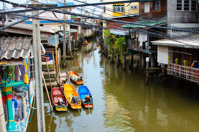 High angle view of canal amidst buildings in city