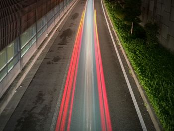 High angle view of light trails on road