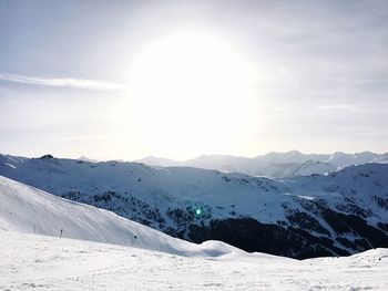 Scenic view of snow mountains against sky