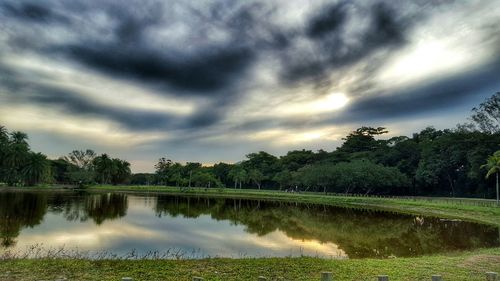 Scenic view of lake against cloudy sky