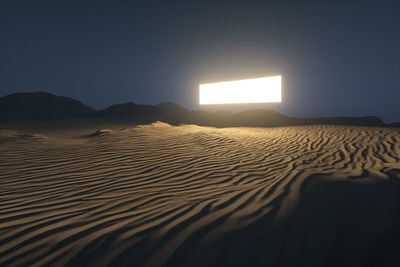 Scenic view of desert against sky during sunset