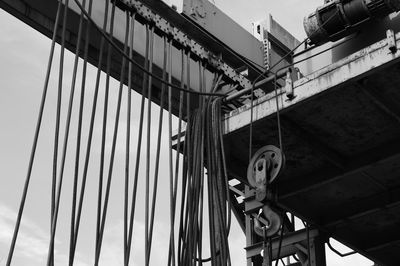 Low angle view of crane against sky