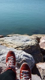 Low section of a man relaxing on shore