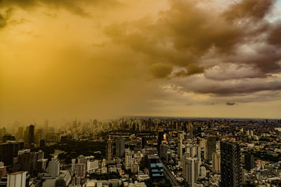 Cityscape against sky during sunset