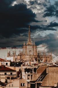 View of buildings against cloudy sky