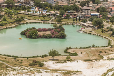 High angle view of lake along trees