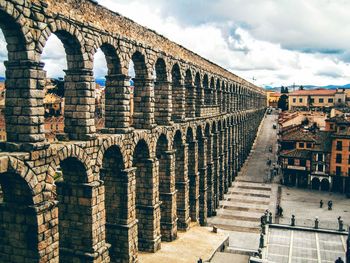 Aqueduct against cloudy sky