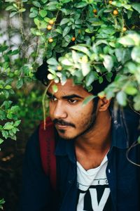 Portrait of young man standing outdoors