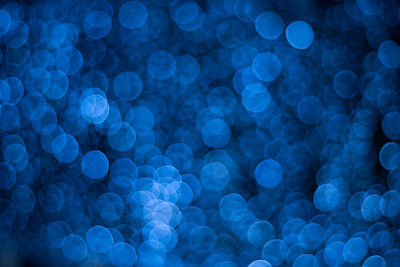 Defocused image of illuminated blue lights