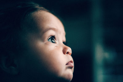 Side view of cute boy looking away