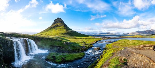 Panoramic view of waterfall against sky