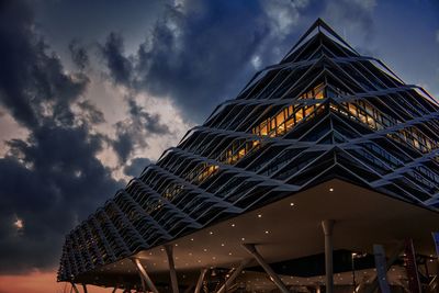 Low angle view of illuminated building against sky