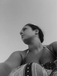 Portrait of young woman looking away