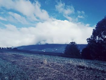 Scenic view of sea against cloudy sky