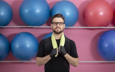 Portrait of man with balloons