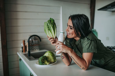 Woman holding food at home