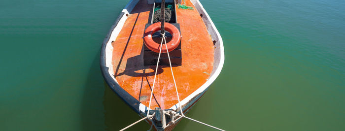 High angle view of sailboat moored in sea