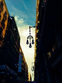 Low angle view of illuminated buildings against sky