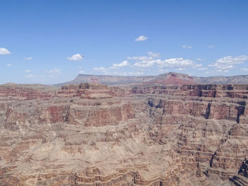 View of desert against cloudy sky