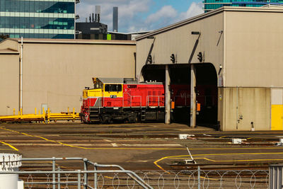 Train at railroad station against sky