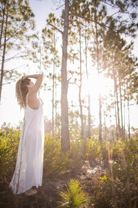 Woman standing in forest