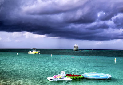 Scenic view of sea against cloudy sky