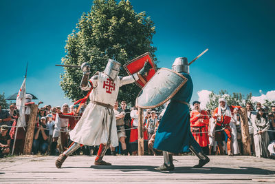 Group of people dancing on street