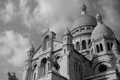 Low angle view of cathedral against cloudy sky