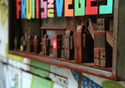 Close-up of text on wooden wall