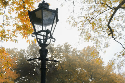 Low angle view of street light against sky