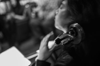 Close-up of female playing violin