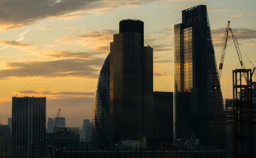 Low angle view of building against sky at sunset