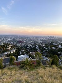 High angle view of buildings against sky during sunset