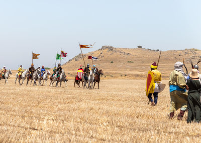 People on field against sky