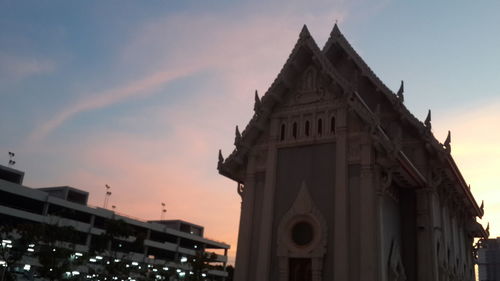 Low angle view of building against sky during sunset