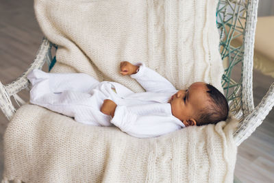 Cute baby sleeping on bed