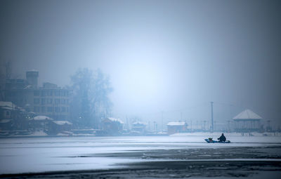City buildings against sky during winter