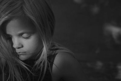 Close-up of thoughtful girl with eyes closed