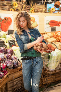 Portrait of smiling woman holding food