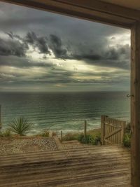 Scenic view of sea against cloudy sky