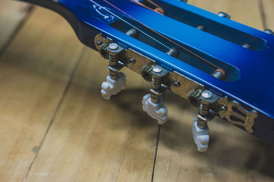 High angle view of guitar on table