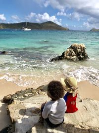 Children glazing across the ocean on a usvi beach