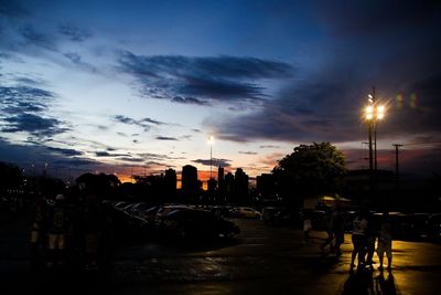 View of illuminated city at sunset