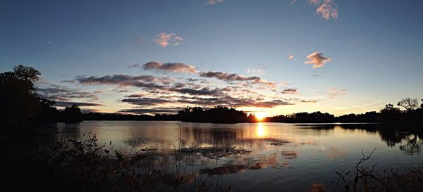 Scenic view of lake at sunset